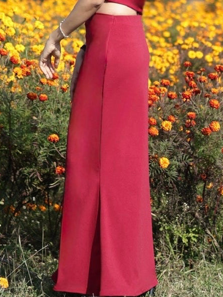 Model wearing maroon long bodycon skirt