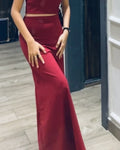 Model wearing maroon long bodycon skirt