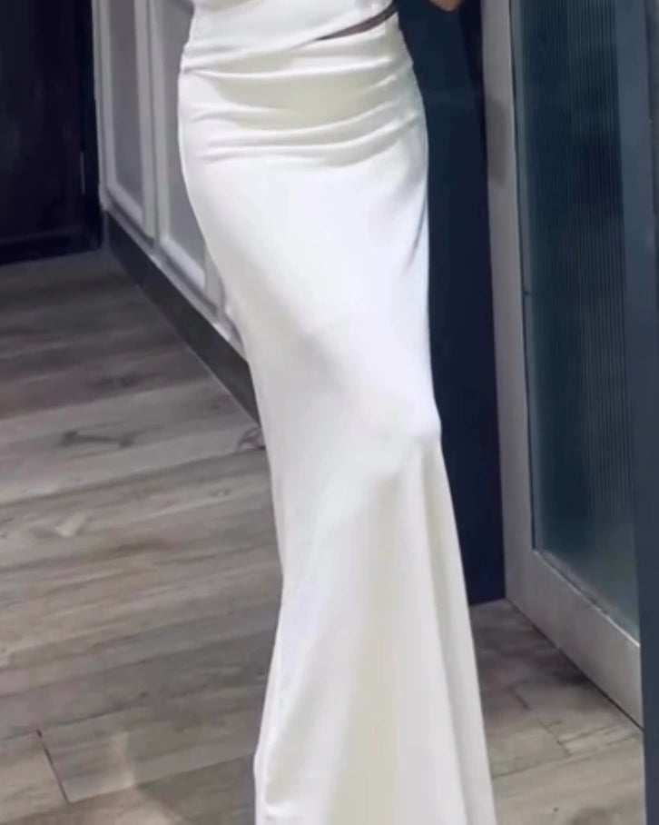 Model wearing white long bodycon skirt