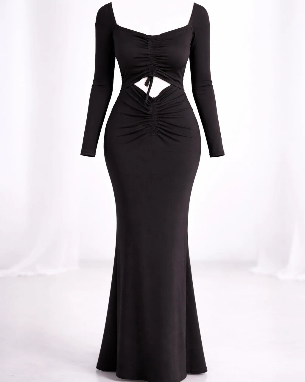 Model wearing black bodycon dress with full sleeves and drawstring detail from neck to waist, fashion desi party wear