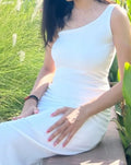 Model wearing white one shoulder dress with detachable beads neck accessories 