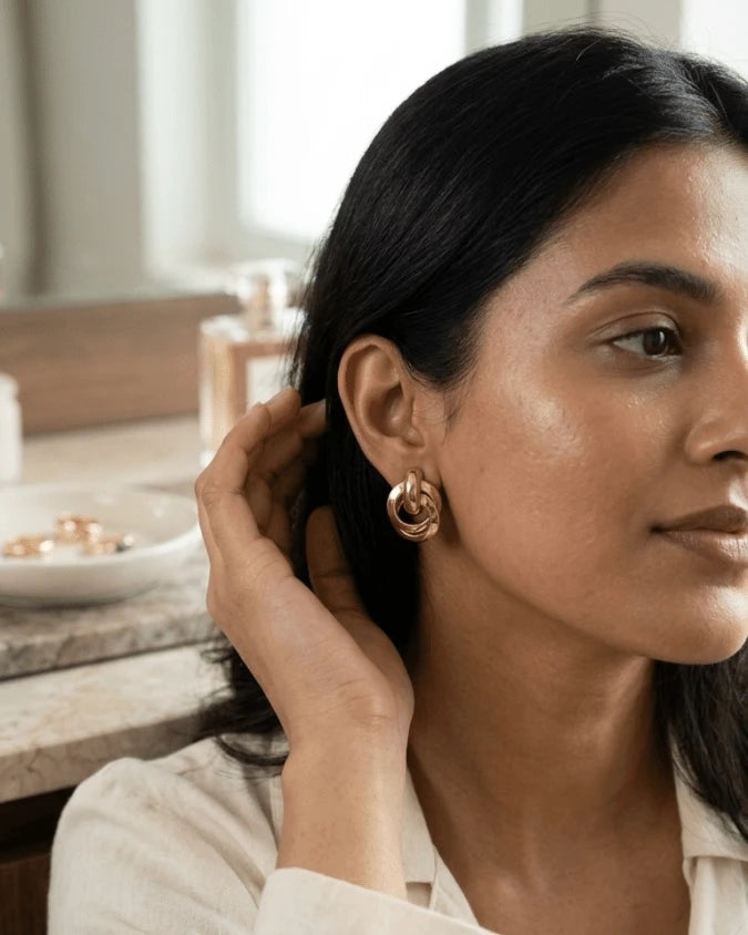 Model wearing Very beautiful golden rounds shape earrings studs