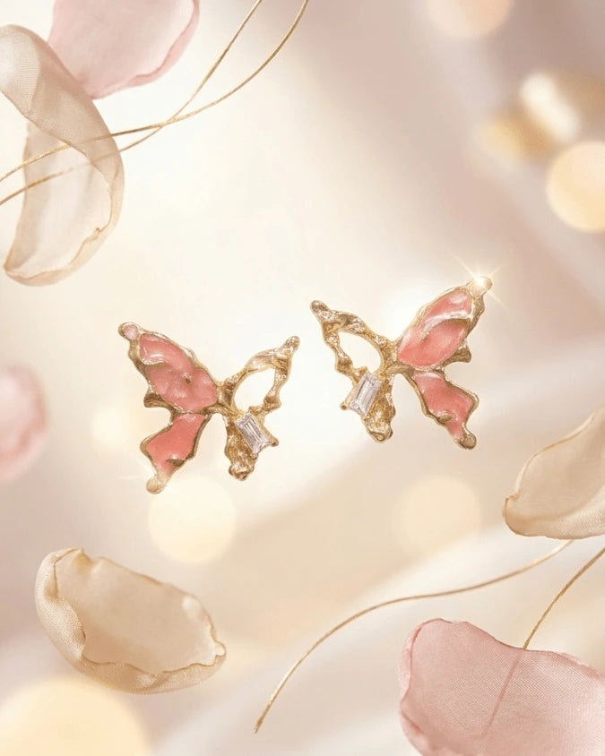 Golden butterfly shaped earring studs with pink colour