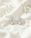 Ivory colour earrings with resin finish in drops shape with two stones on it