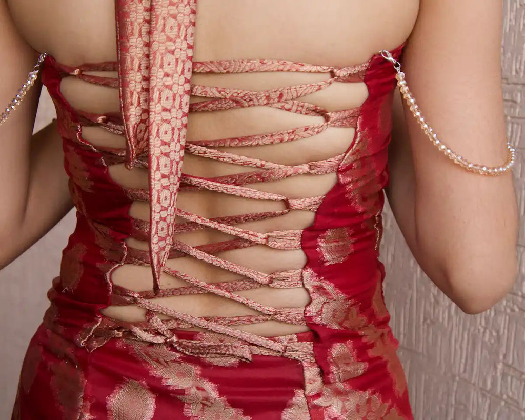 closeup of maroon corset top back side of top with lace up back and detachable beads design