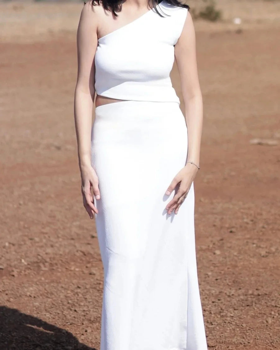 White colour co-ord set with long bodycon skirt with one shoulder crop top with up down waist top pattern On model