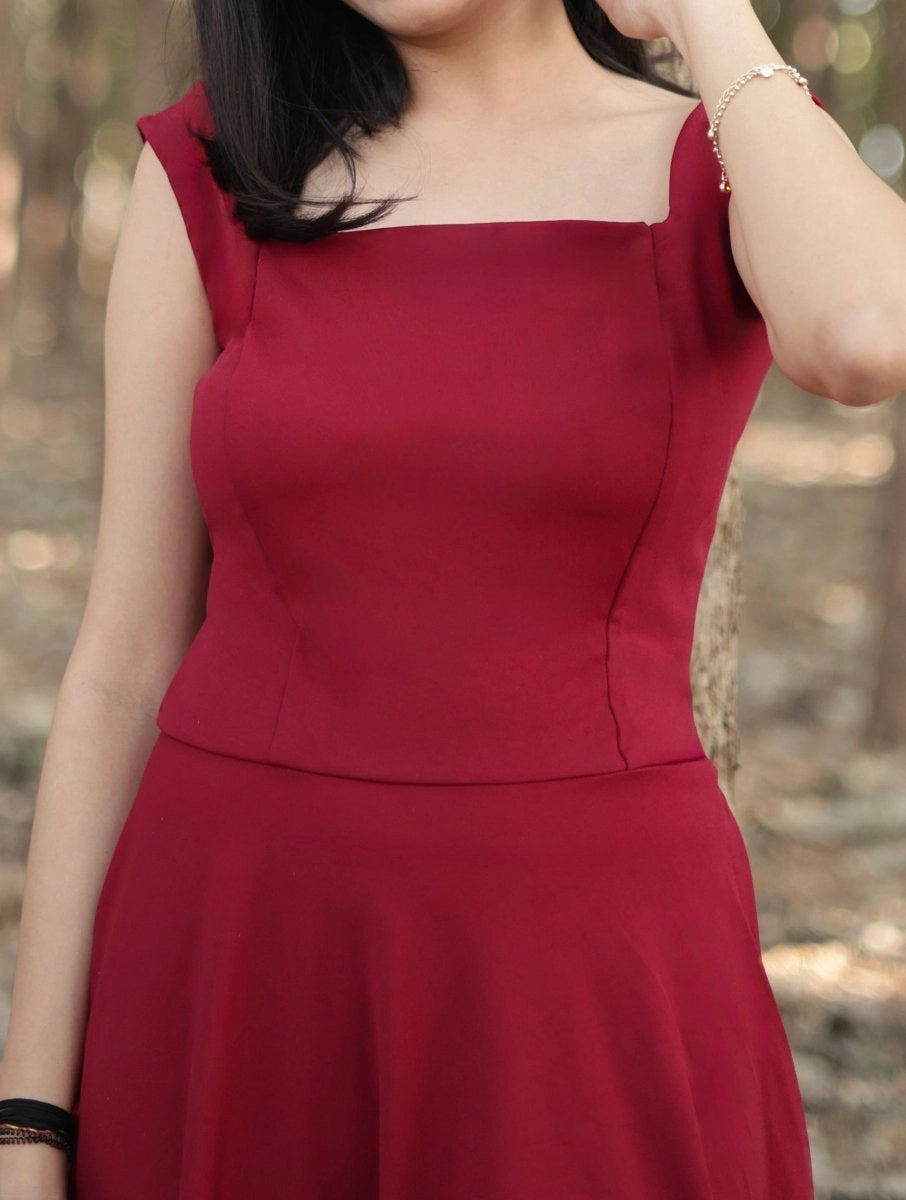 Maroon calf length dress with square neck and backless pattern with sleeve less, circular bottom dress Closeup image
