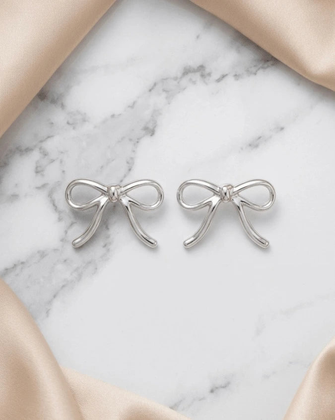 Silver colour big bow shape earrings studs, light weight