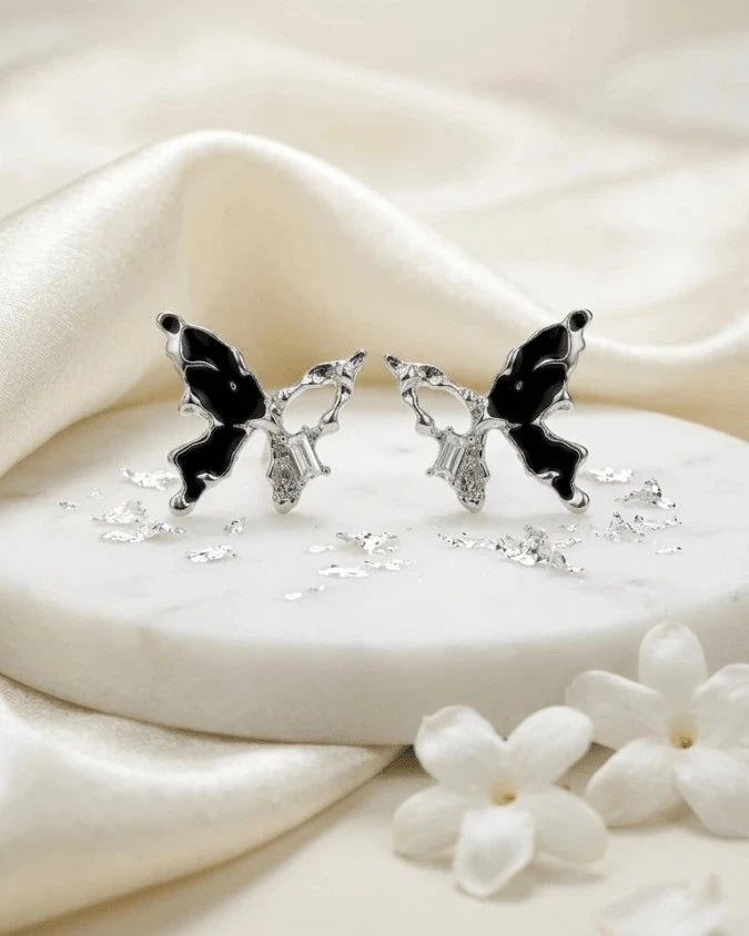 Silver butterfly shaped earring studs with black colour