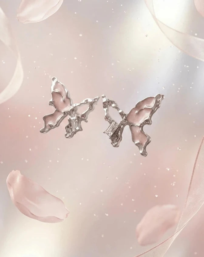 Silver butterfly shaped earring studs with light pink colour