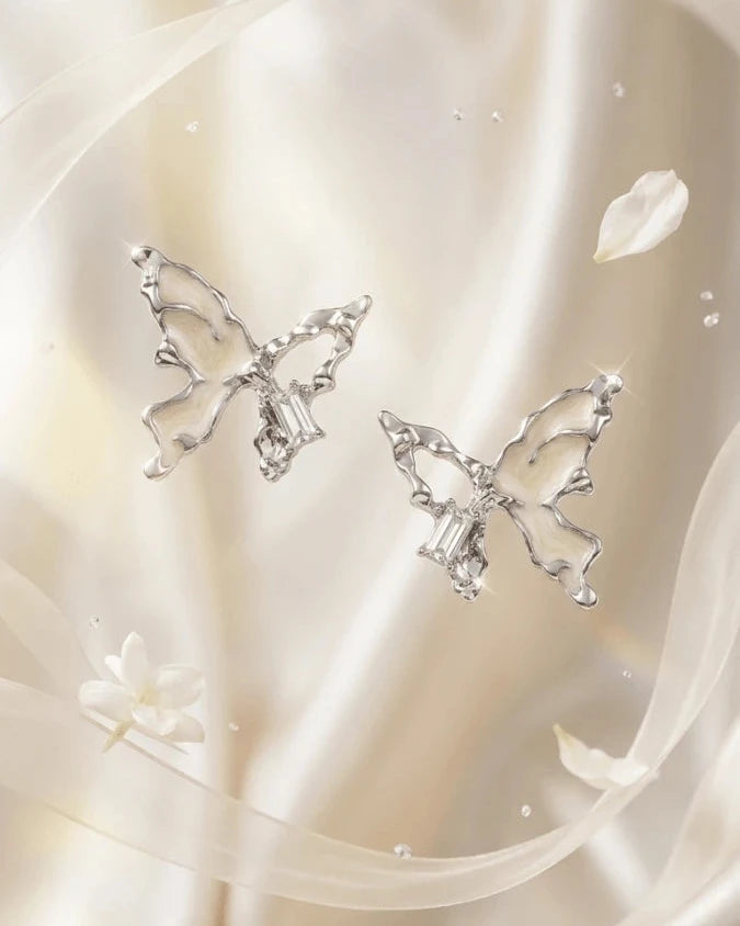 Silver butterfly shaped earring studs with white colour