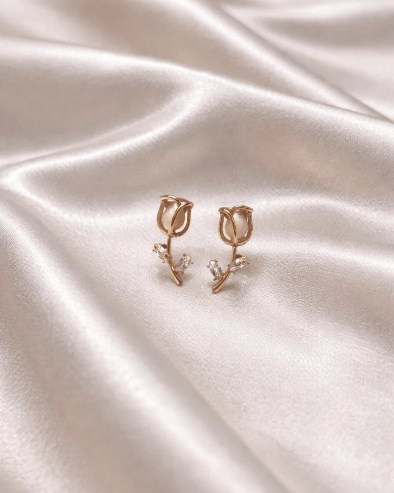 Tulip flower like earring studs with small diamonds on it , rose gold colour