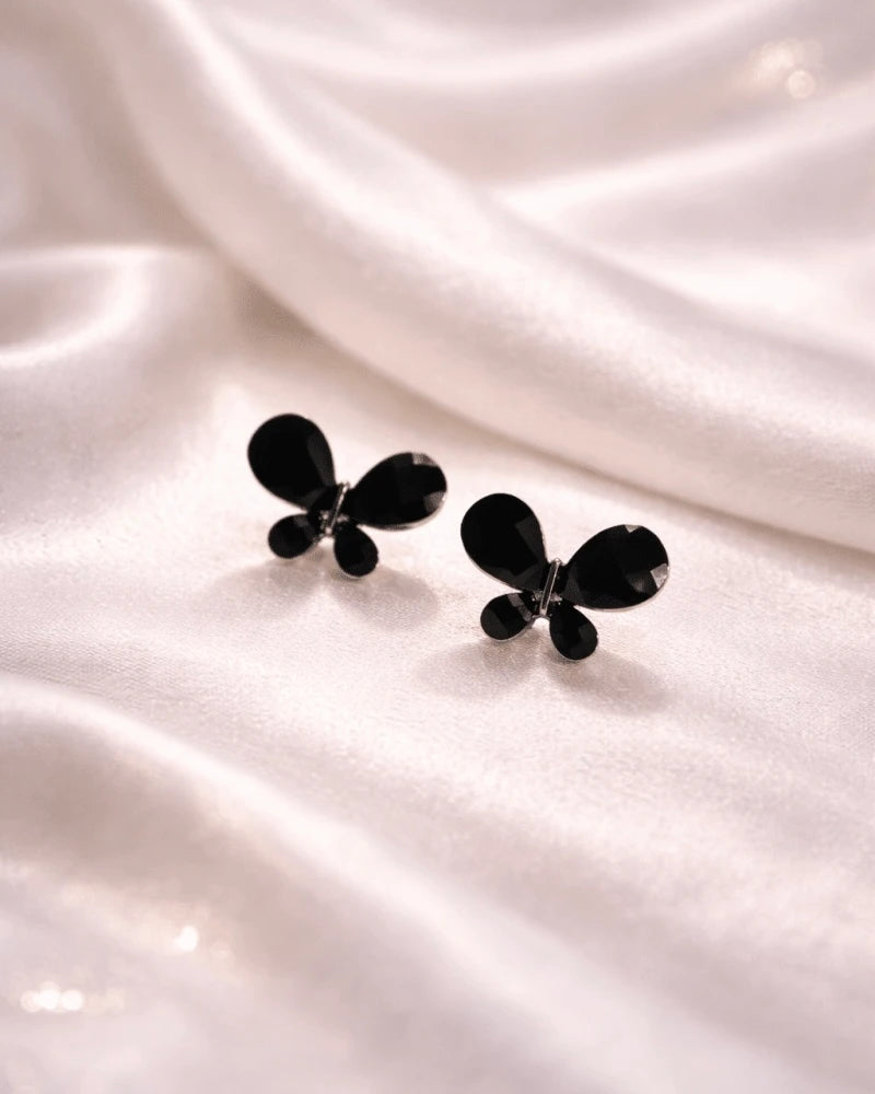 Butterfly shape earring studs blue colour with black diamonds on it