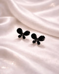 Butterfly shape earring studs blue colour with black diamonds on it
