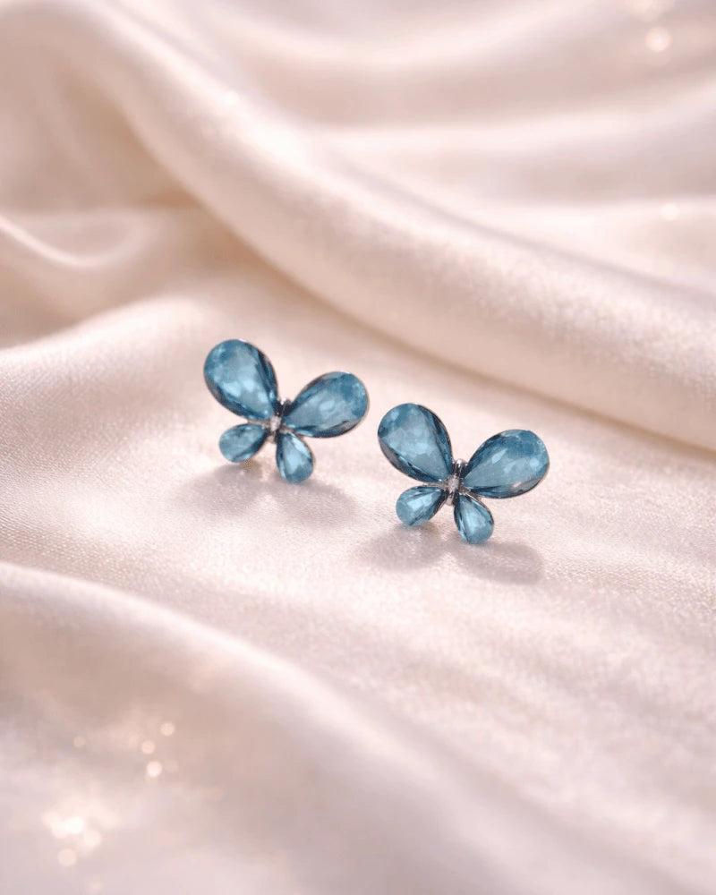 Butterfly shape earring studs blue colour with blue diamonds on it