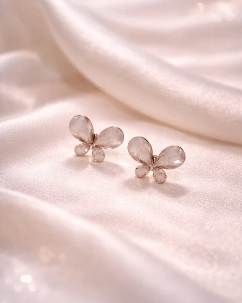 Butterfly shape earring studs blue colour with pink diamonds on it
