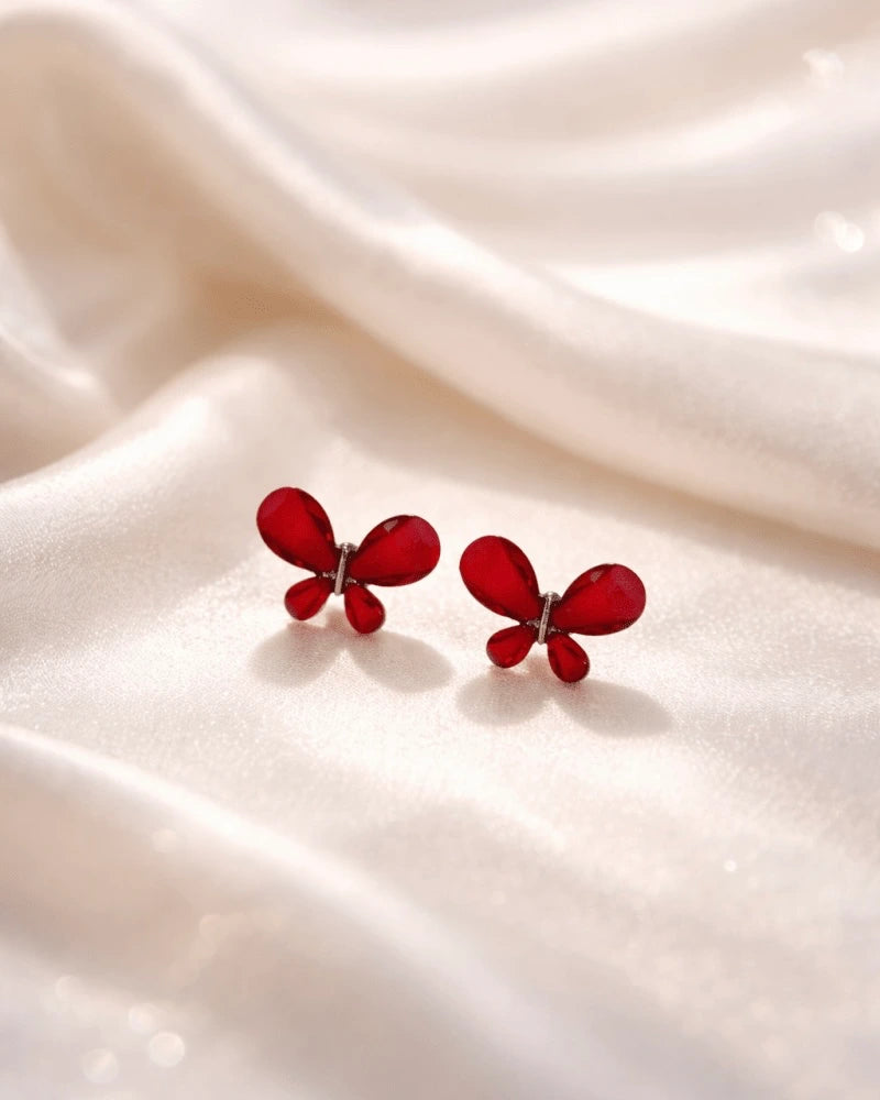 Butterfly shape earring studs blue colour with red diamonds on it