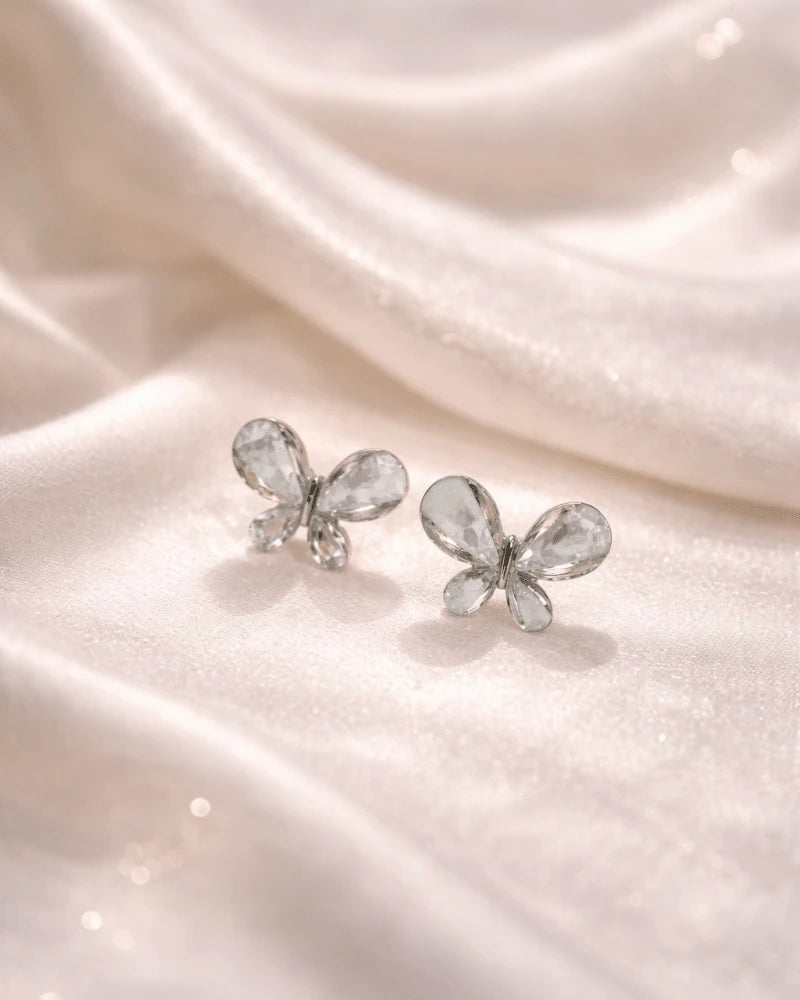 Butterfly shape earring studs blue colour with white diamonds on it